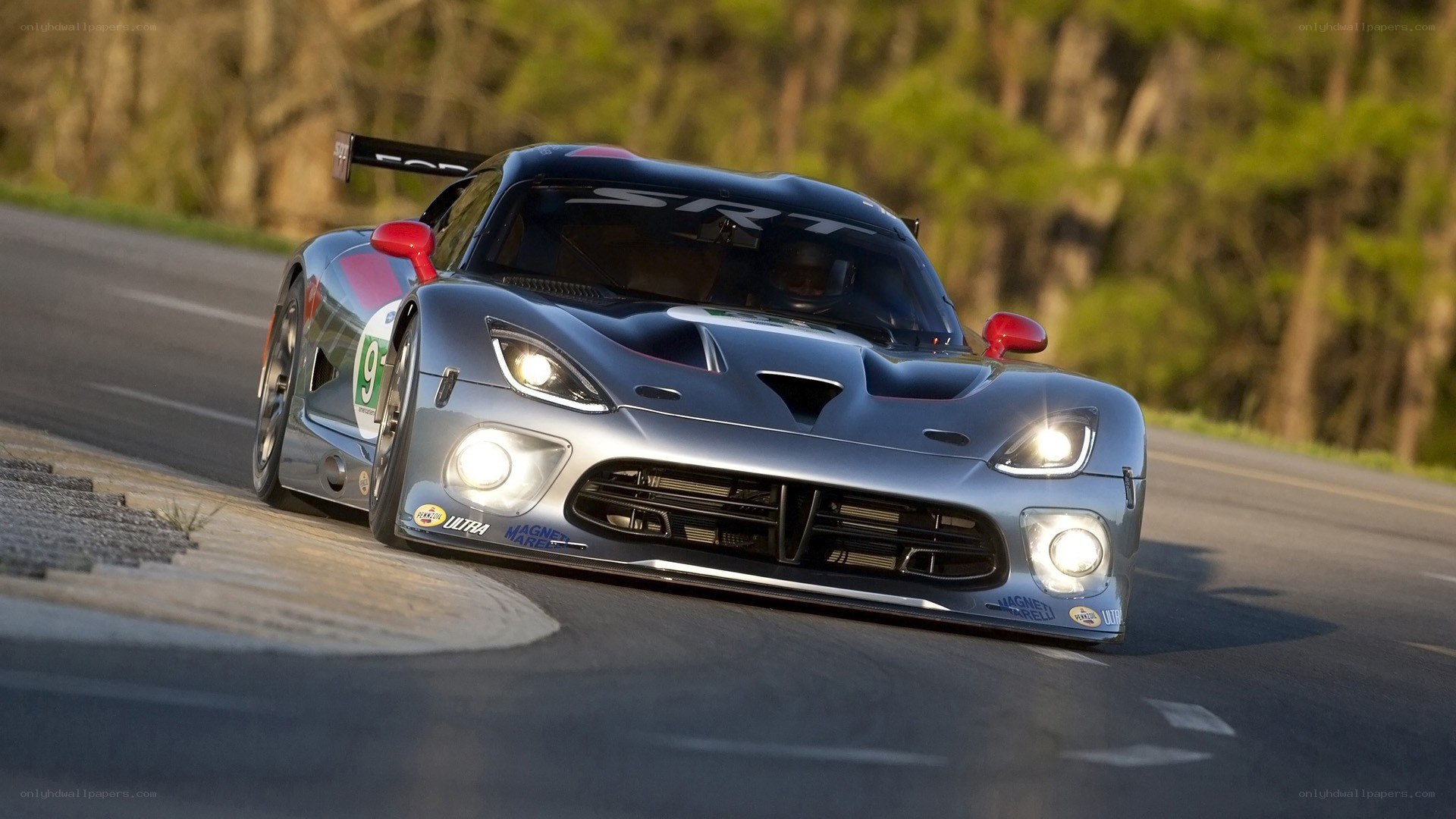 silver race car on track