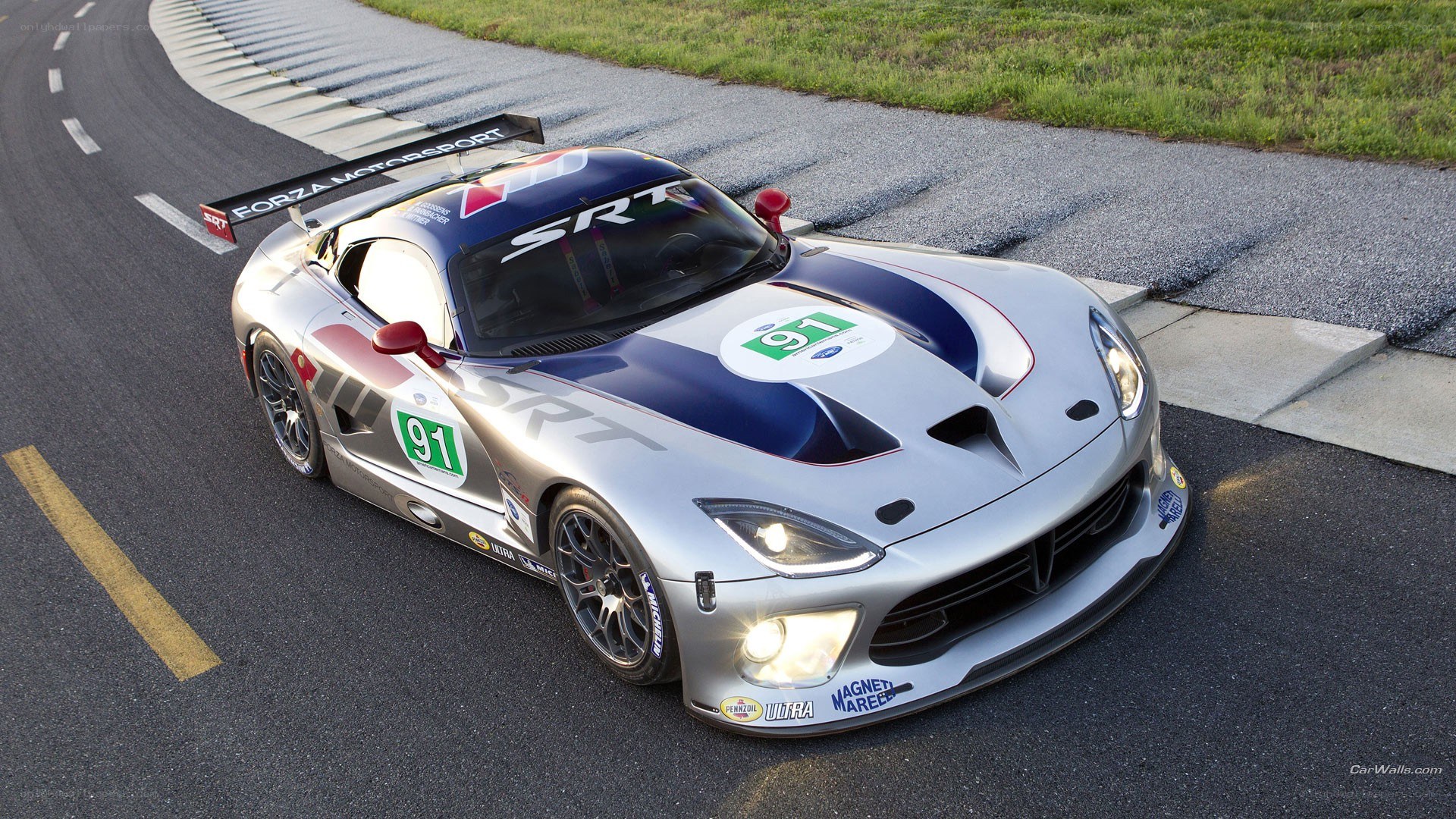 Silver race car on track