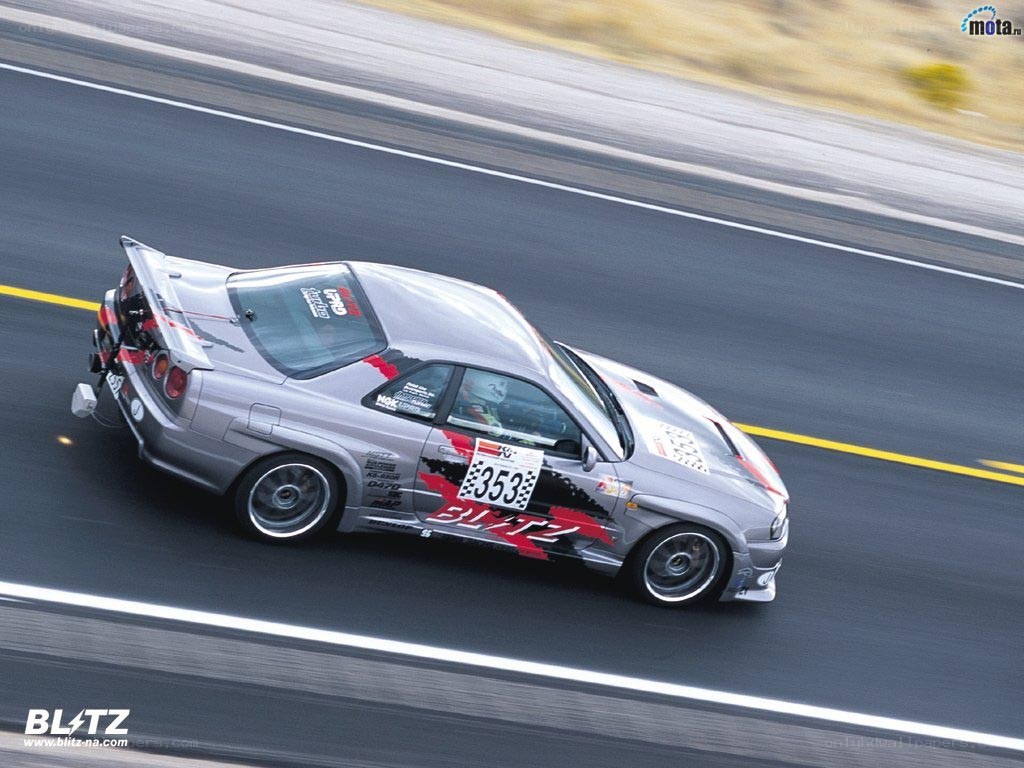 silver race car on track
