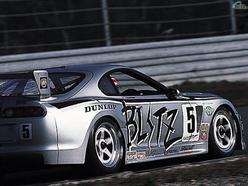 silver race car on track