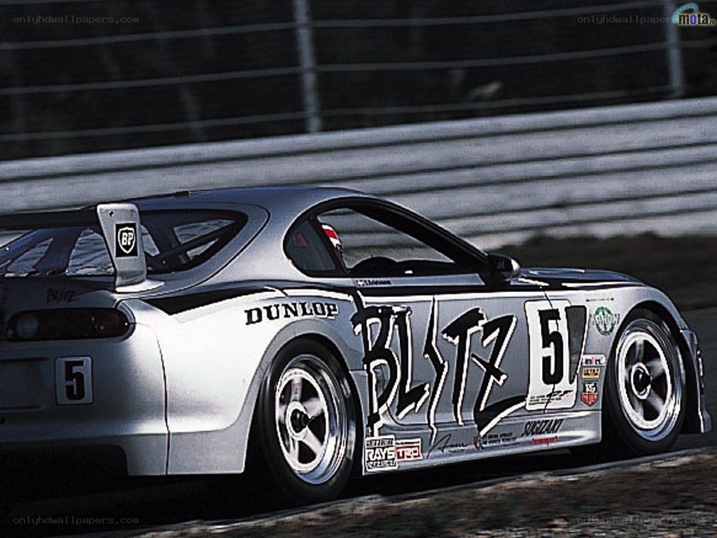 silver race car on track