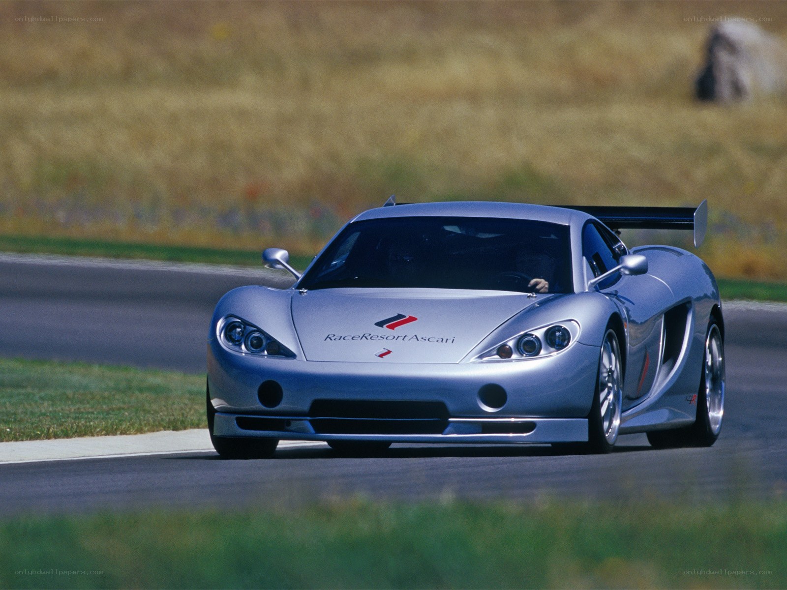 Silver race car on track