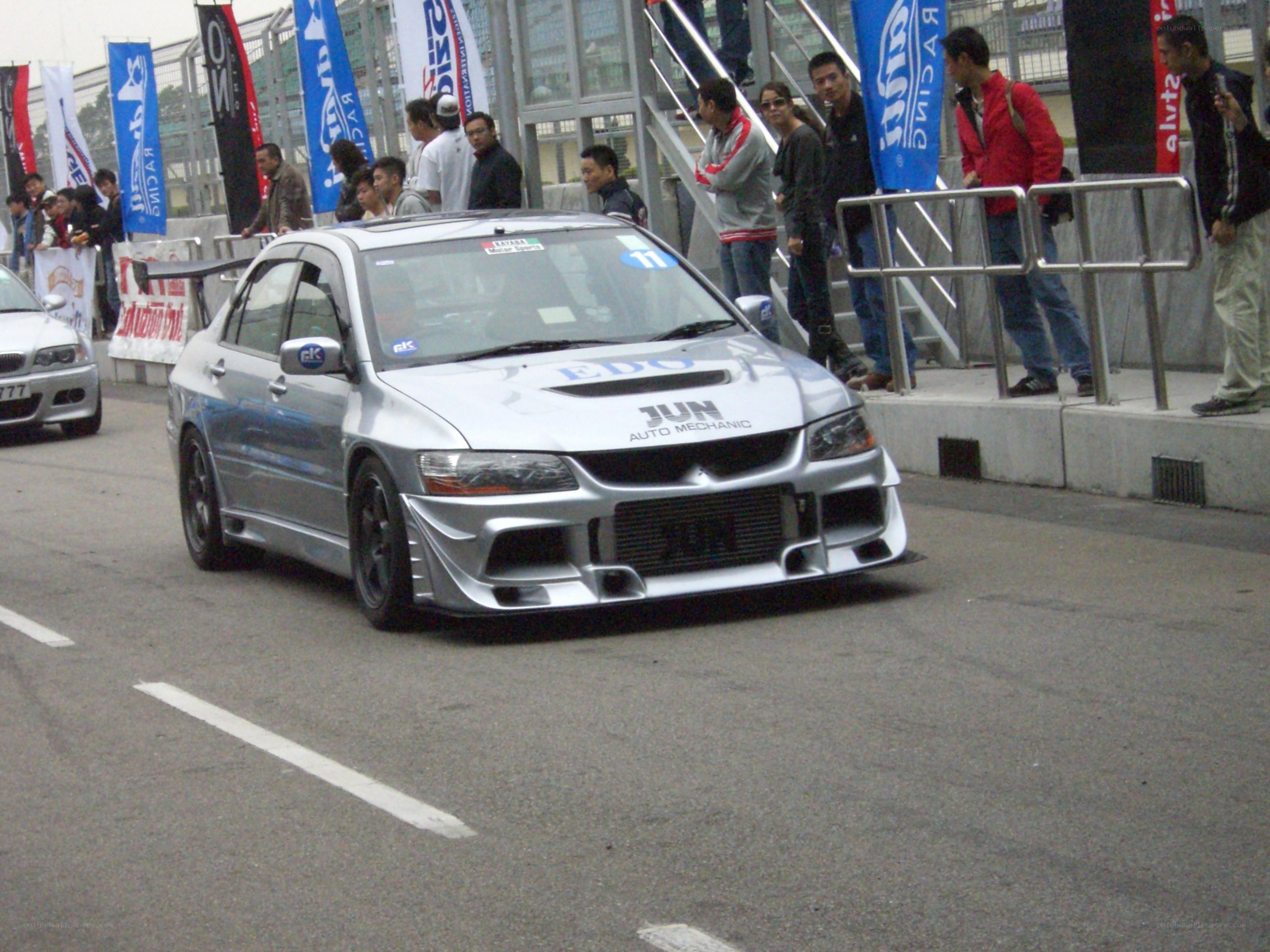 Silver race car on track