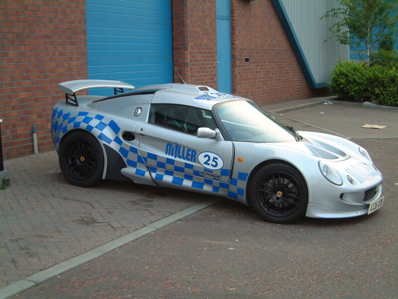 silver race car with checkered livery