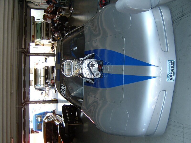 silver race car with exposed engine