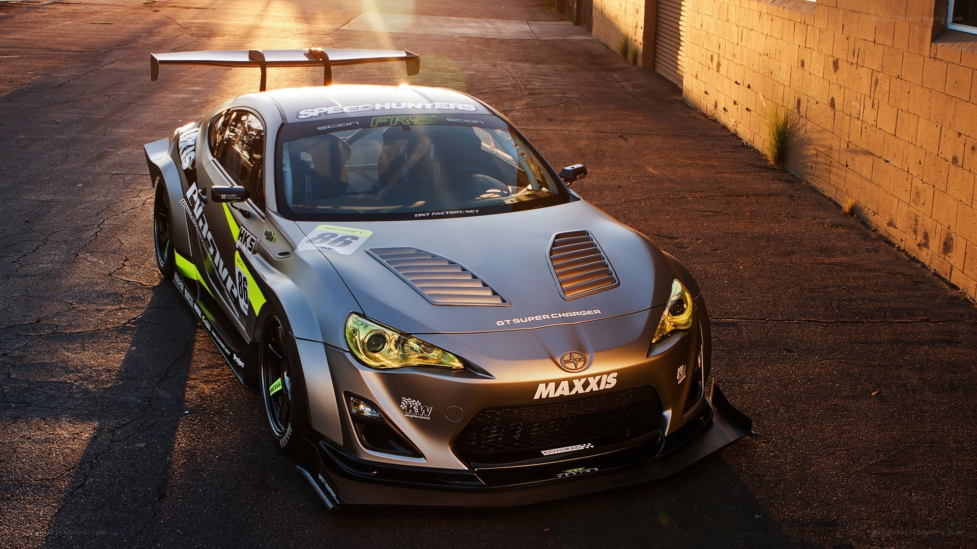 silver race car with large wing