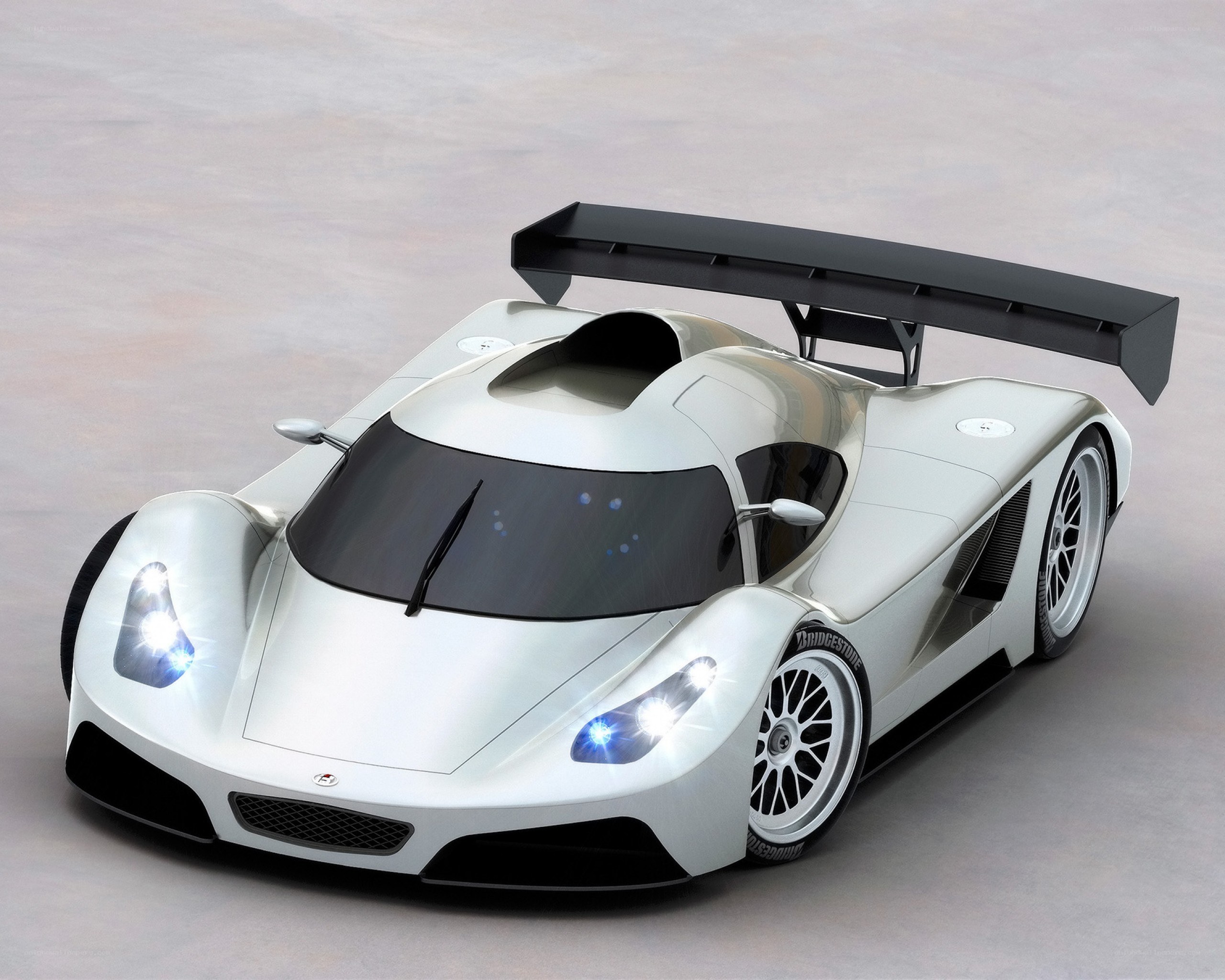 silver race car with large wing