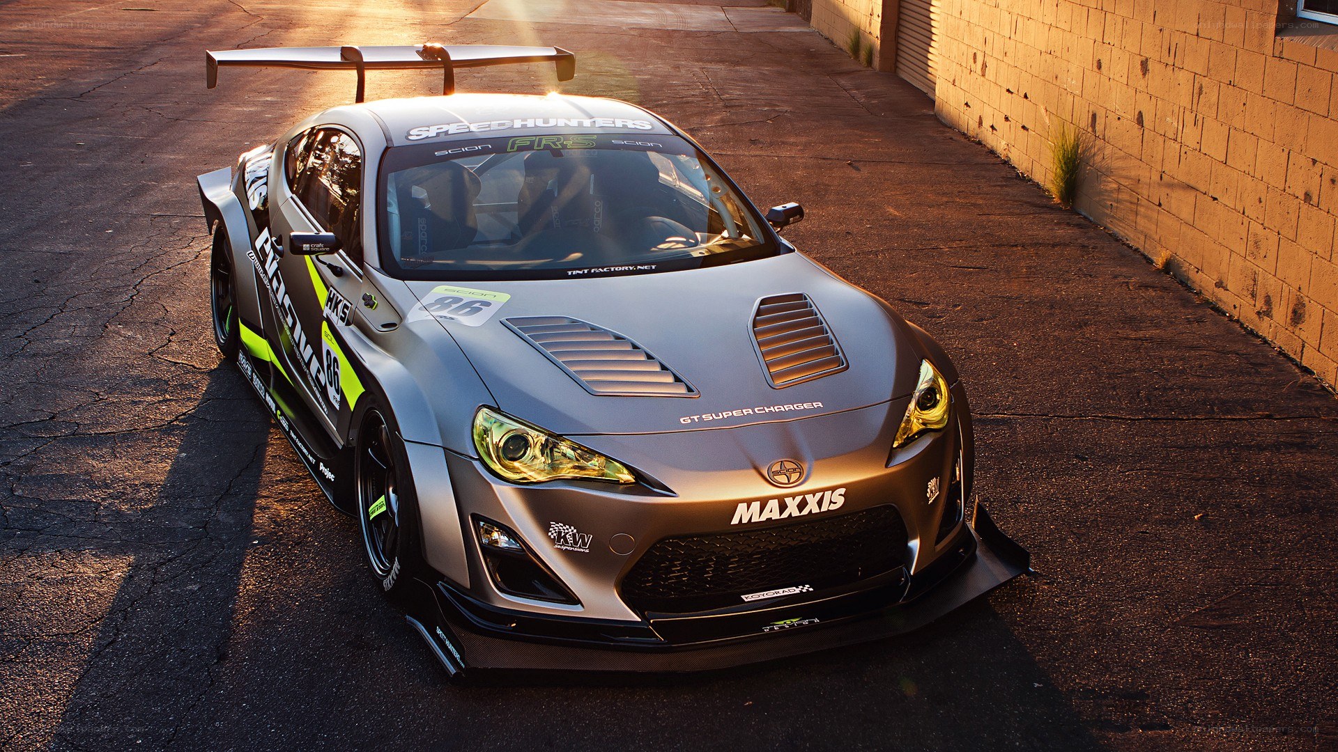 silver race car with large wing