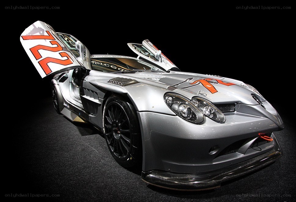 Silver race car with open doors