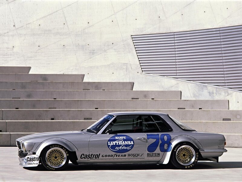 Silver race car with sponsor decals