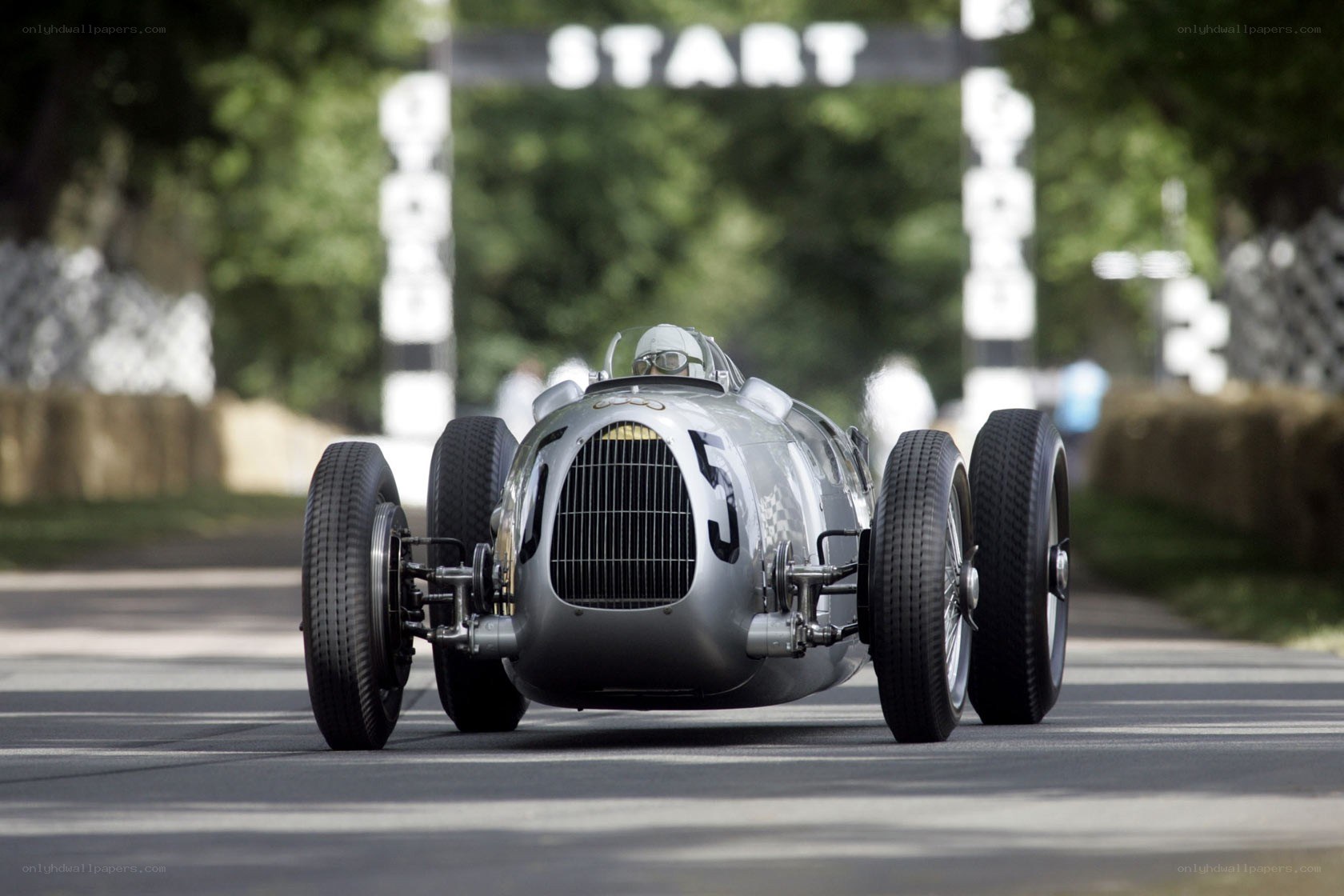Silver racing car at start line