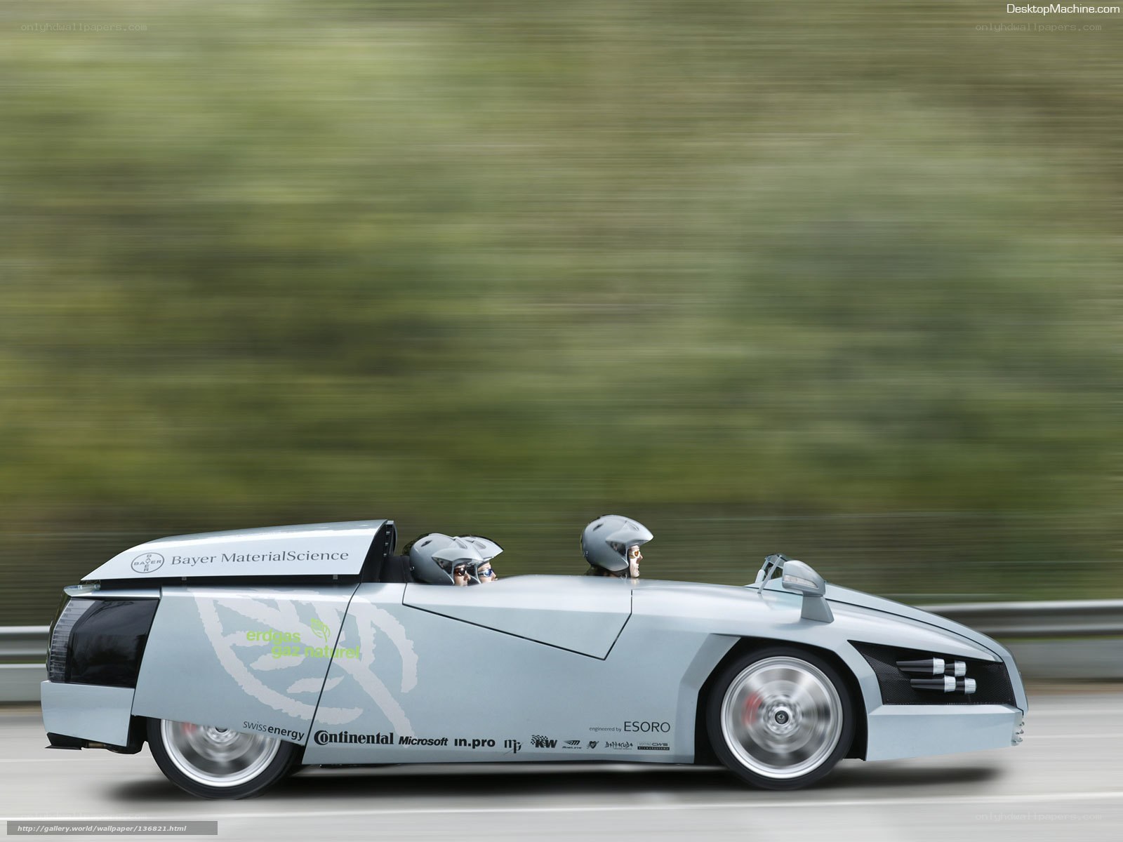 Silver racing car in motion