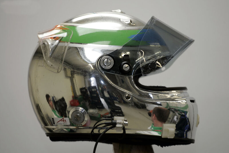 silver racing helmet with green stripe