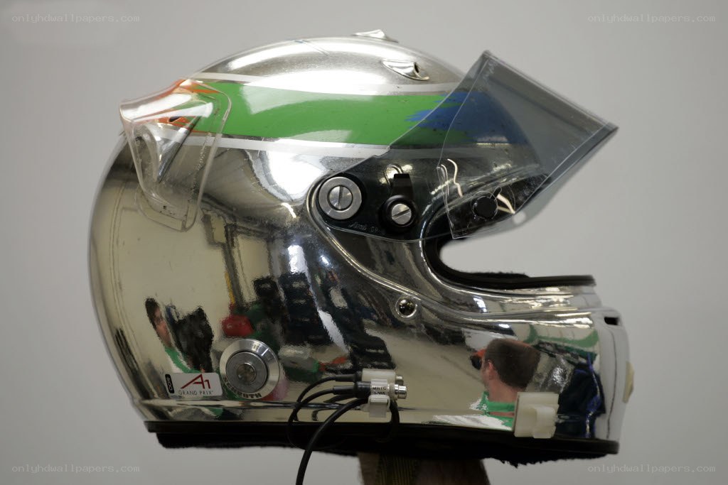 silver racing helmet with green stripe