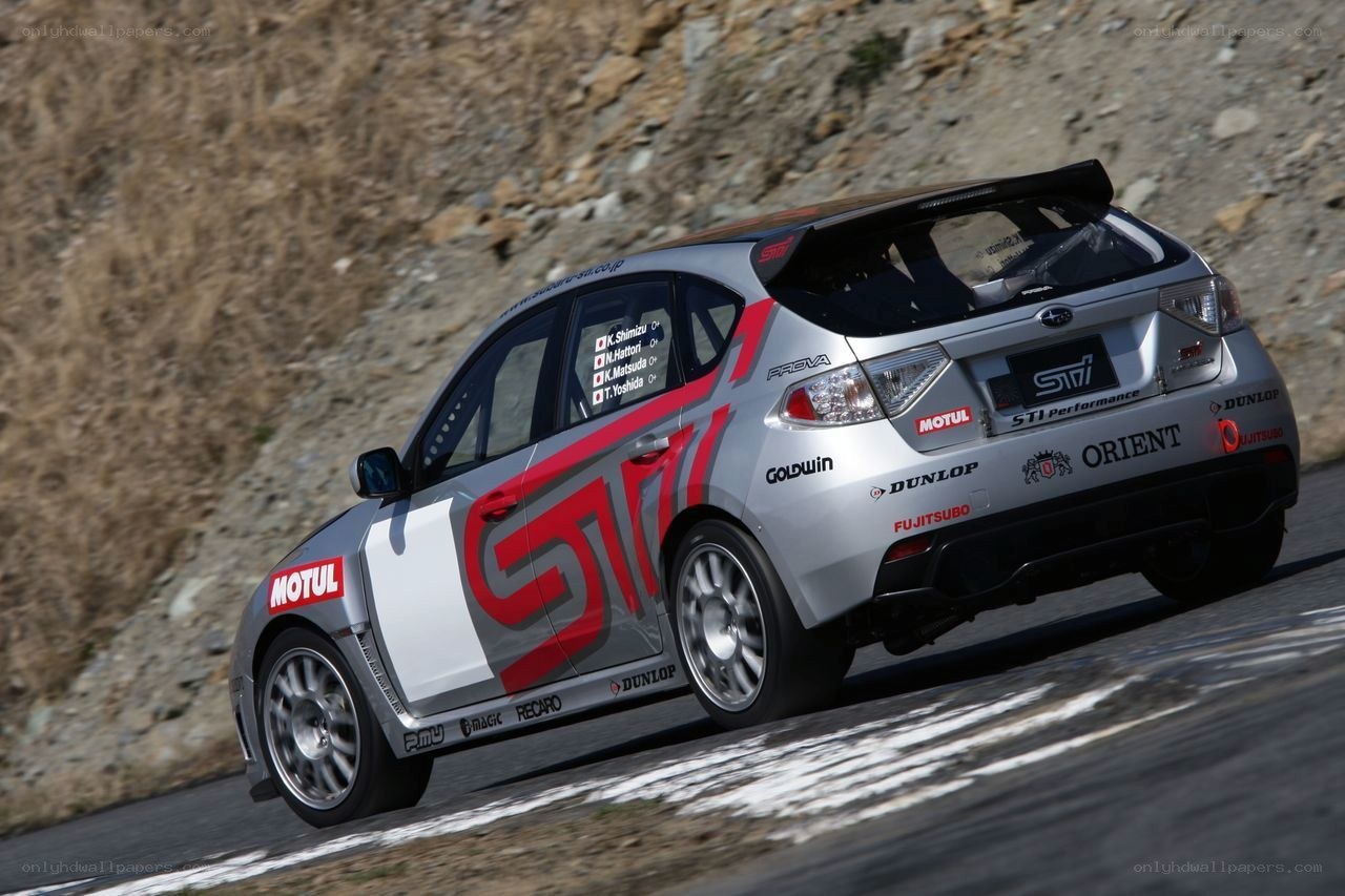 silver rally car on track