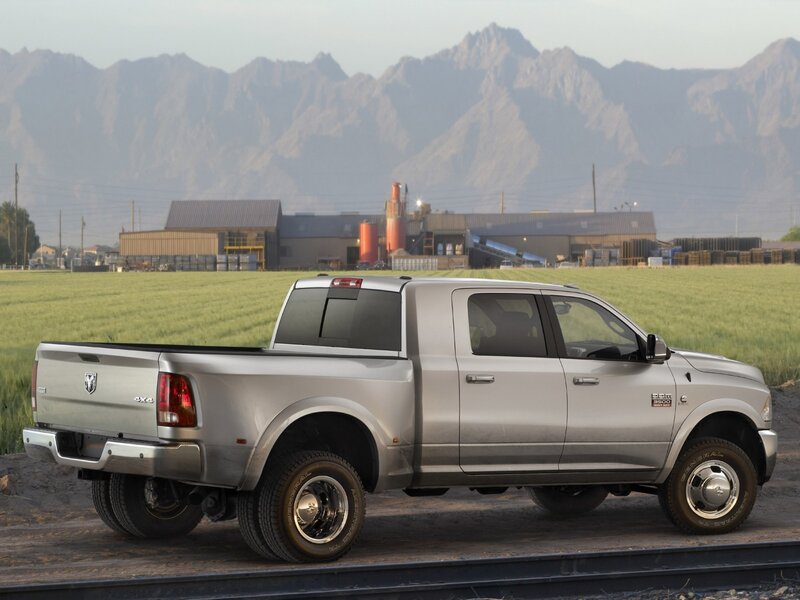 Silver Ram pickup truck in field