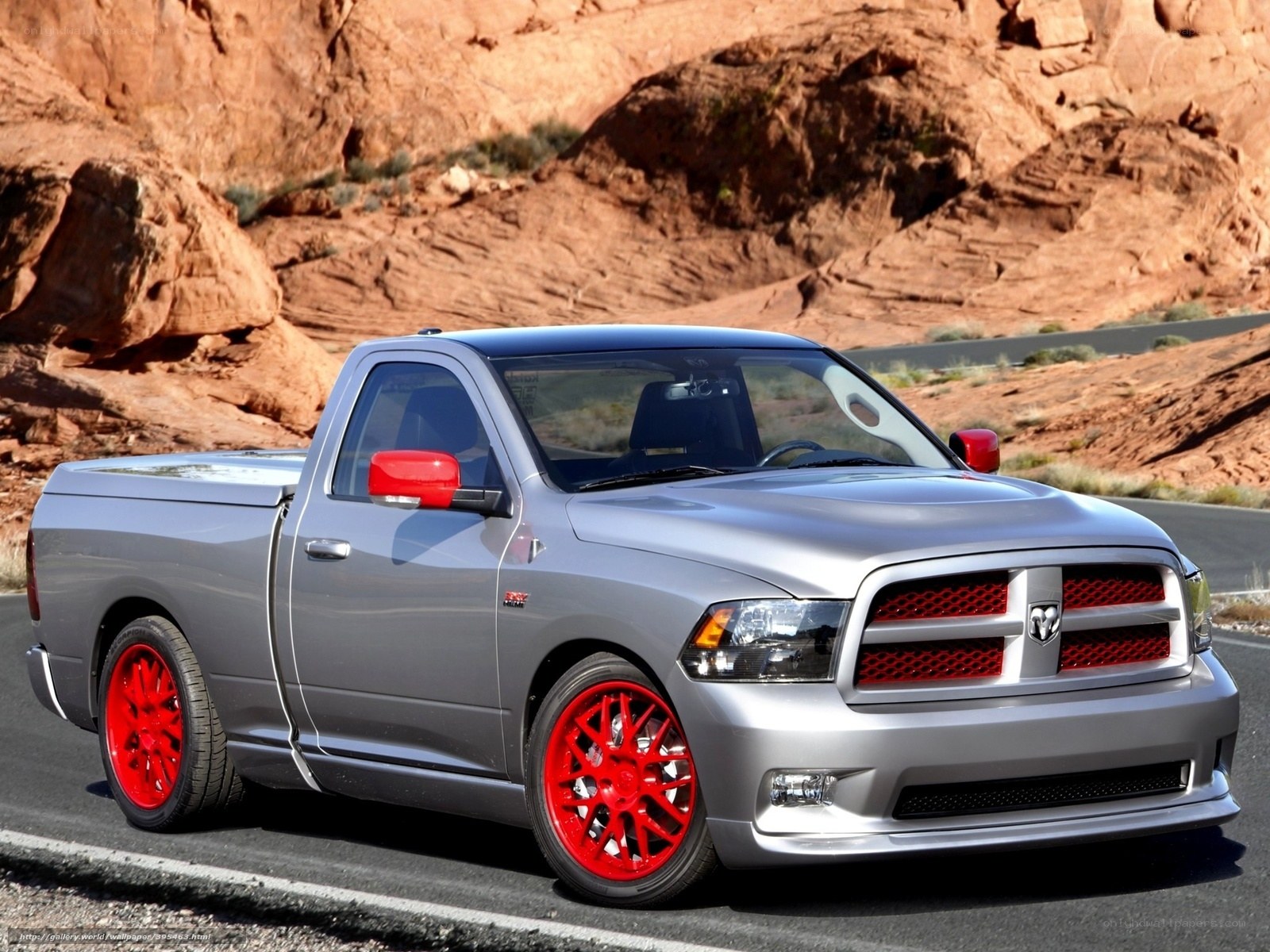 silver ram truck on desert road