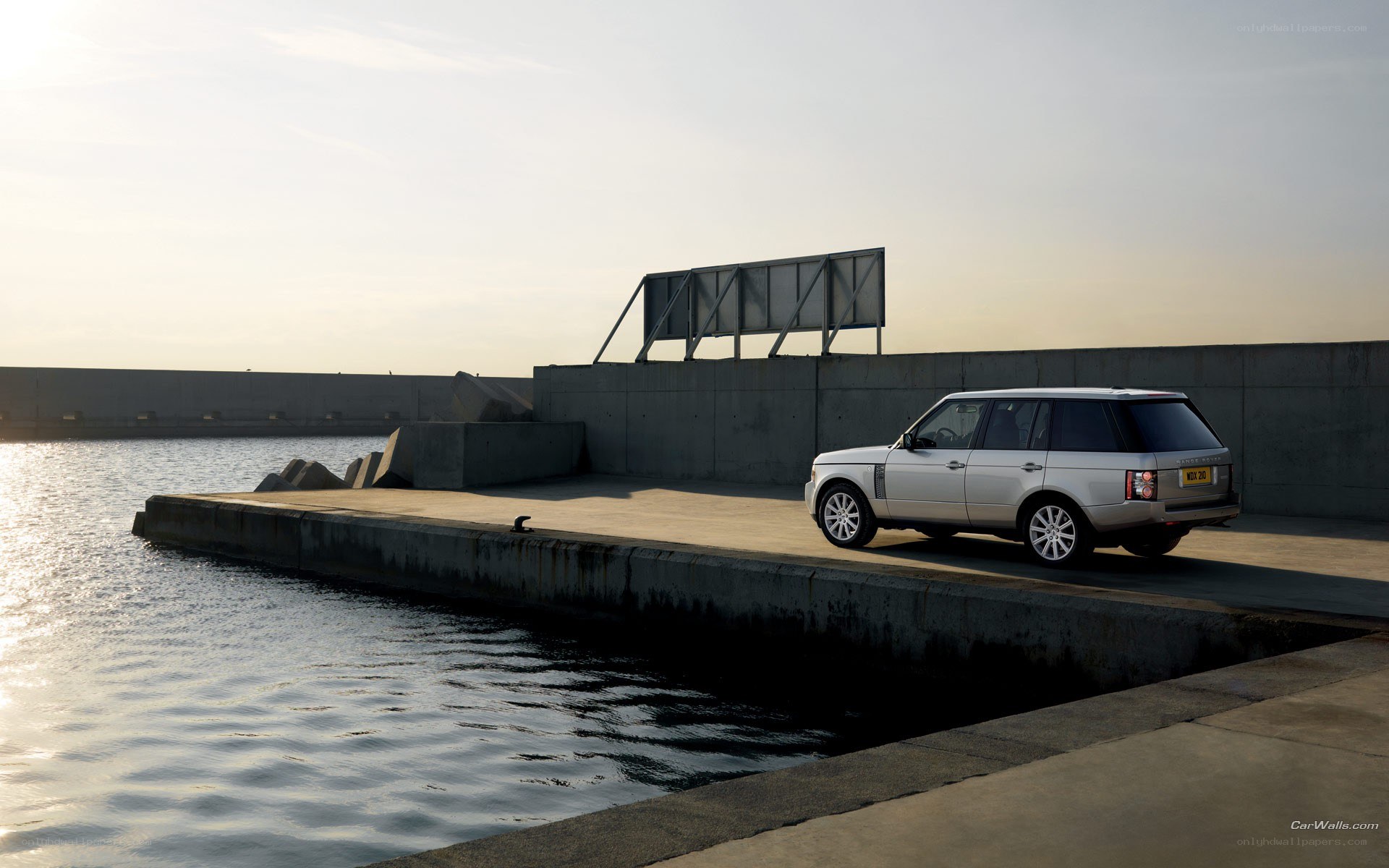 Silver Range Rover at a dock