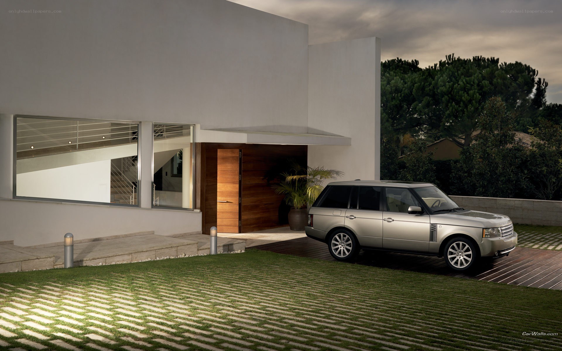Silver Range Rover at modern home