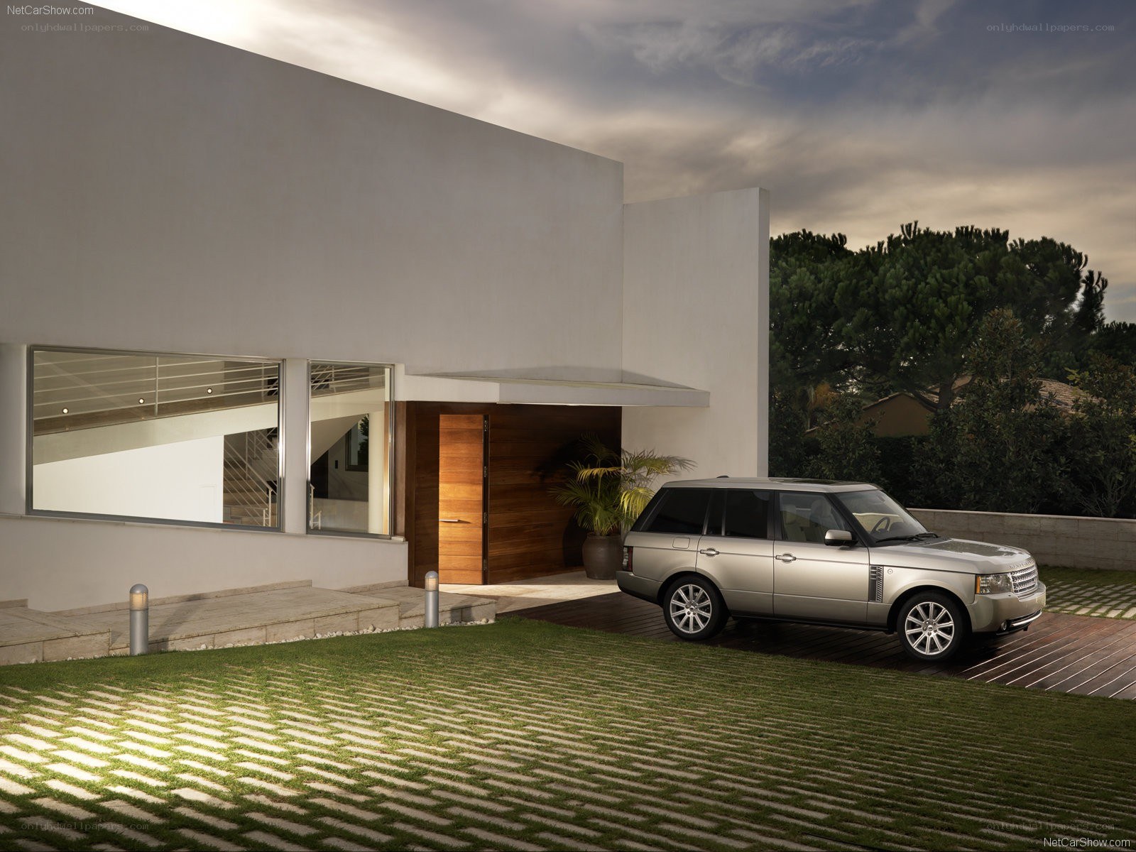Silver Range Rover at modern home