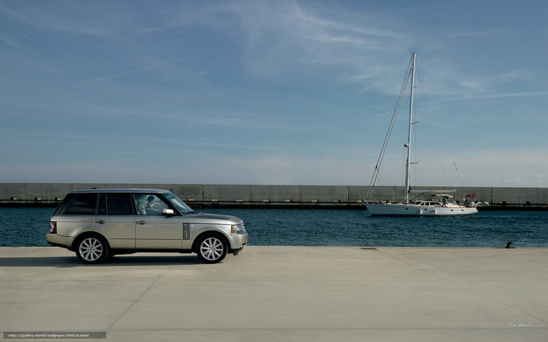 silver range rover by the harbor