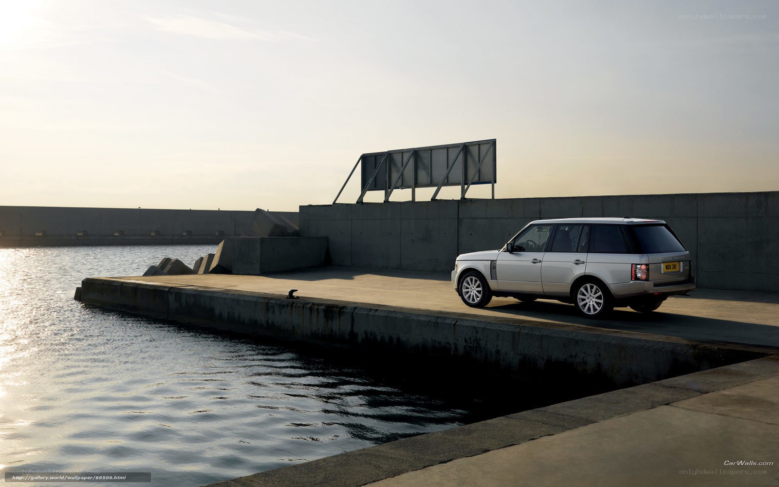 silver range rover by the water