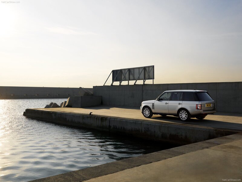 Silver Range Rover by water