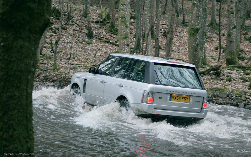 silver range rover crossing stream