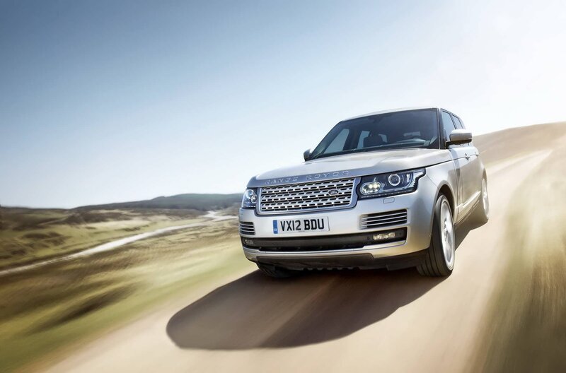 silver range rover driving on road