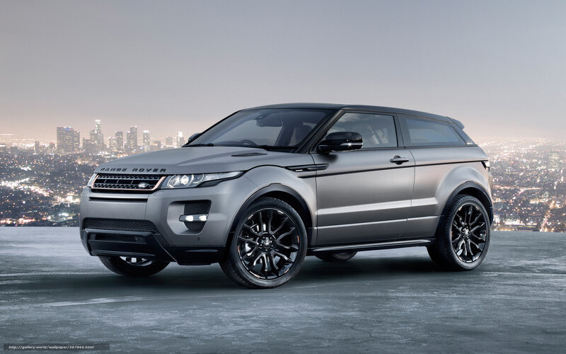 Silver Range Rover in cityscape