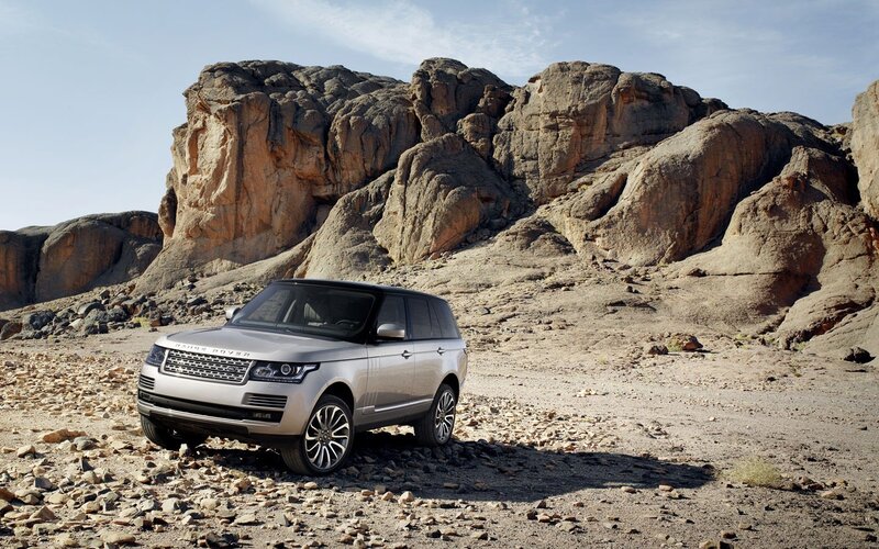 Silver Range Rover in desert