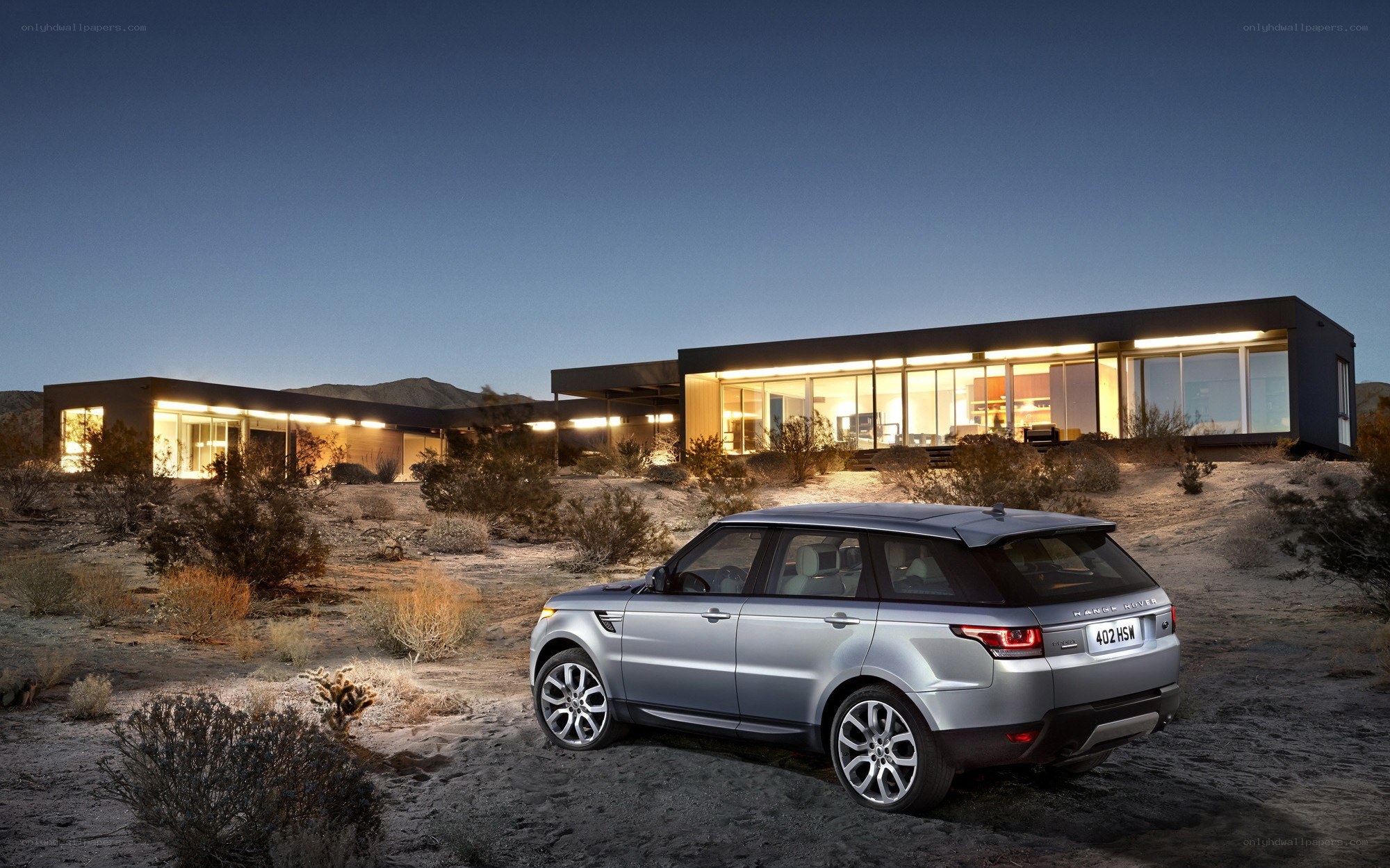 Silver Range Rover in desert