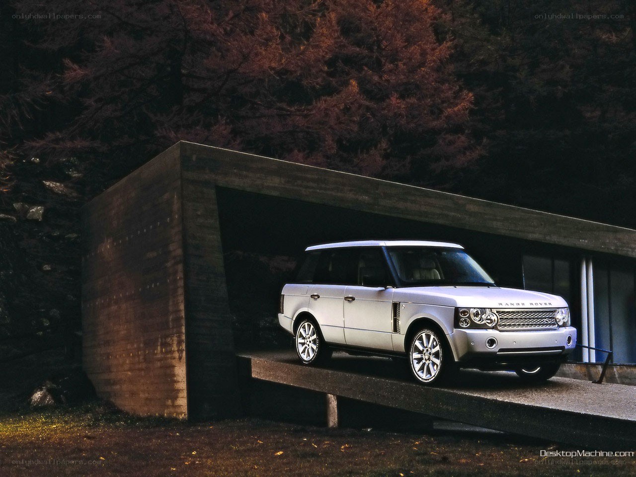Silver Range Rover in modern garage