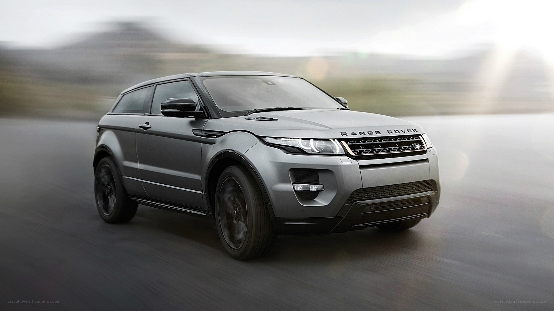 silver range rover in motion
