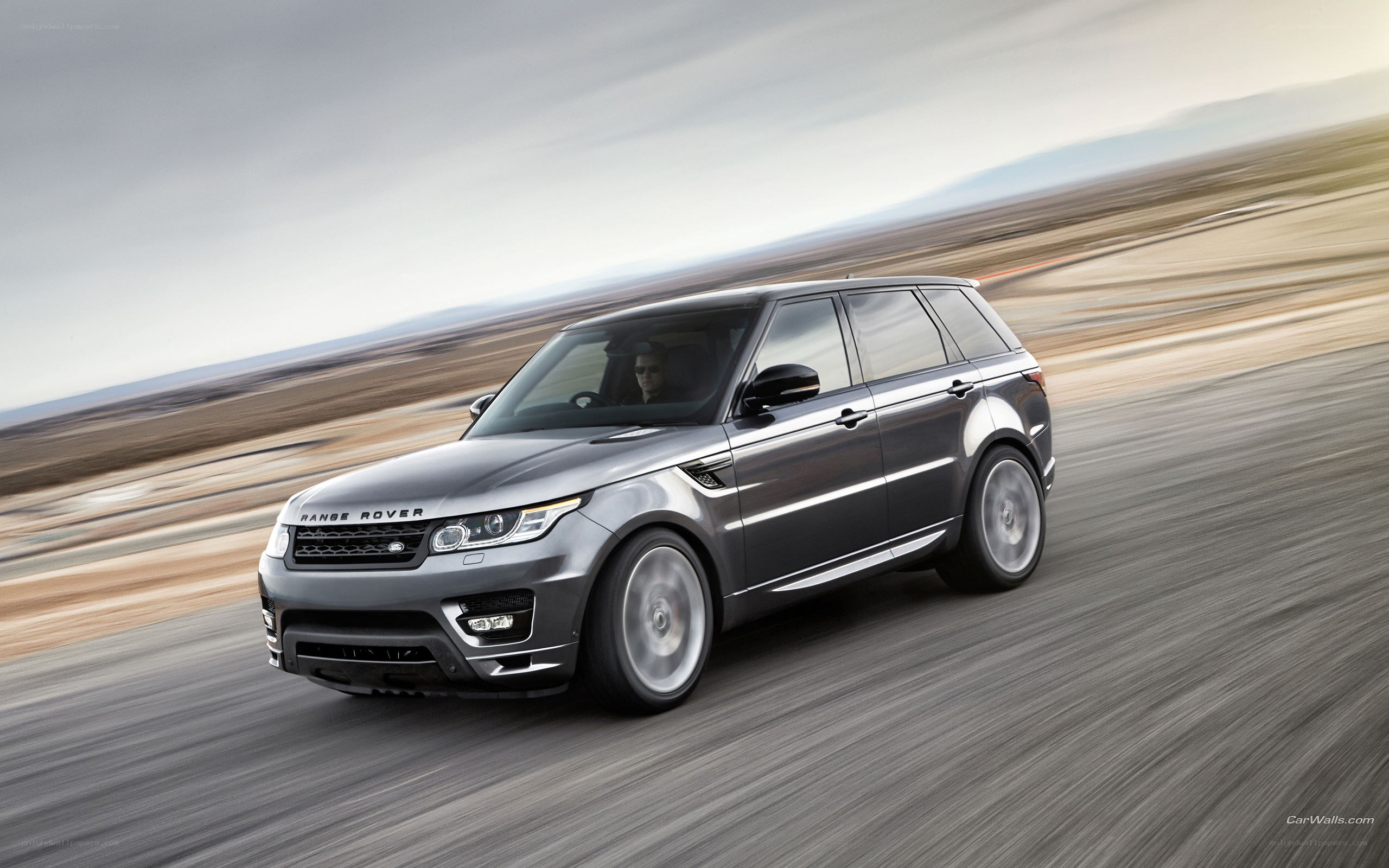 silver range rover in motion