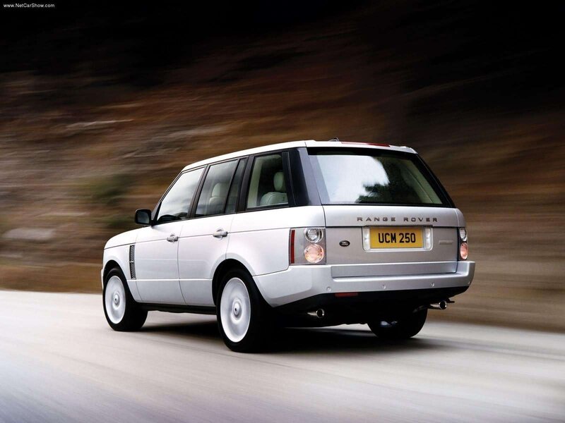 silver range rover in motion