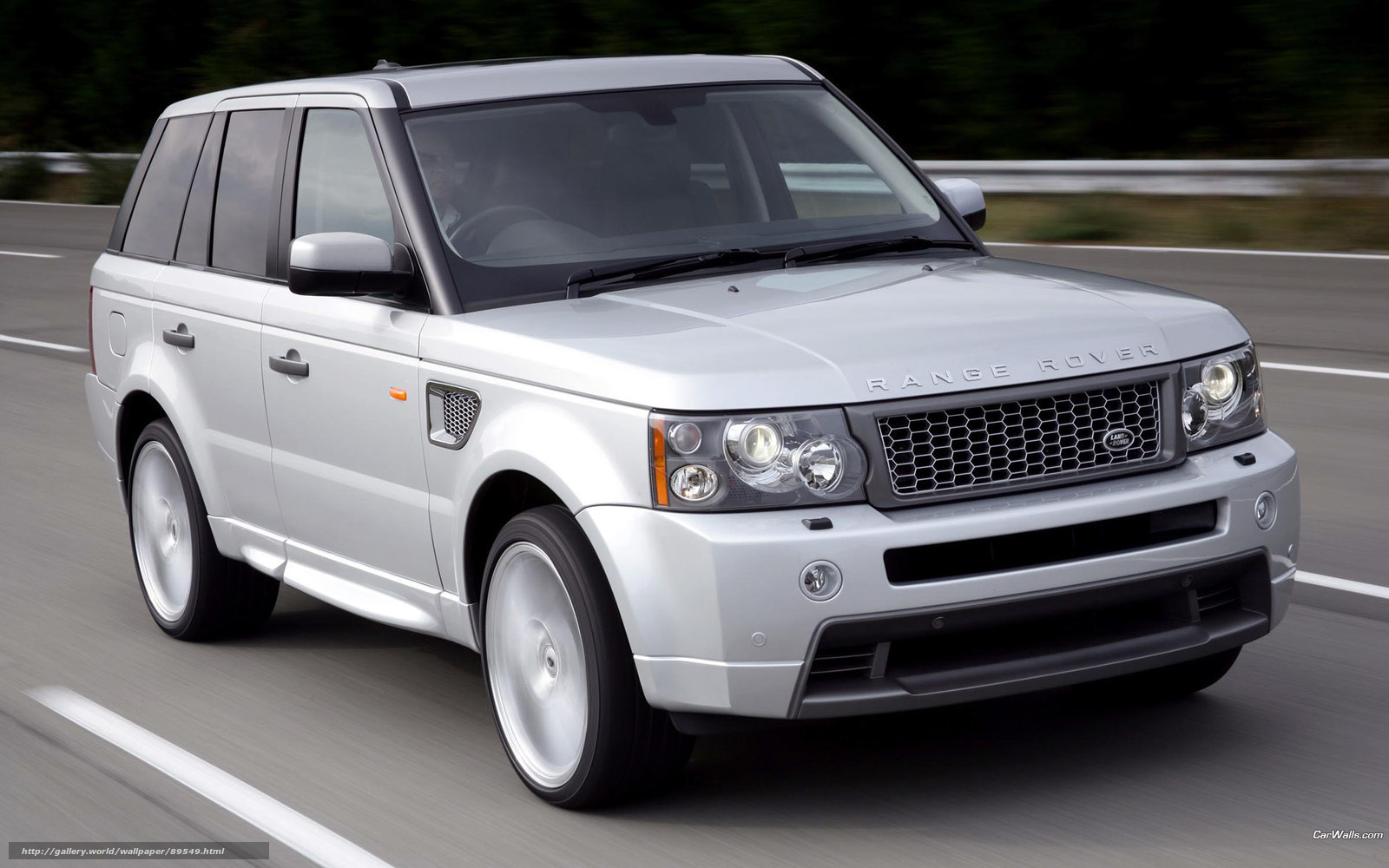 silver range rover in motion