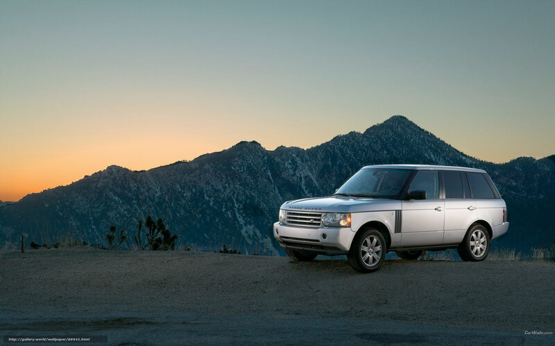 Silver Range Rover in mountain landscape