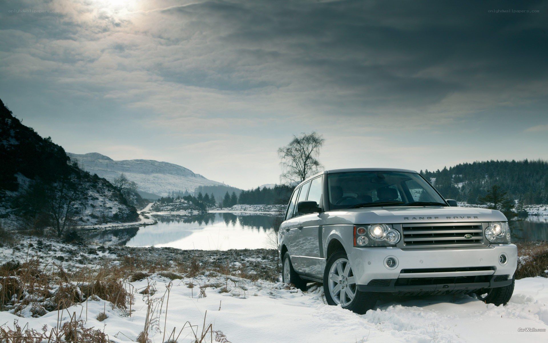 Silver Range Rover in snowy landscape