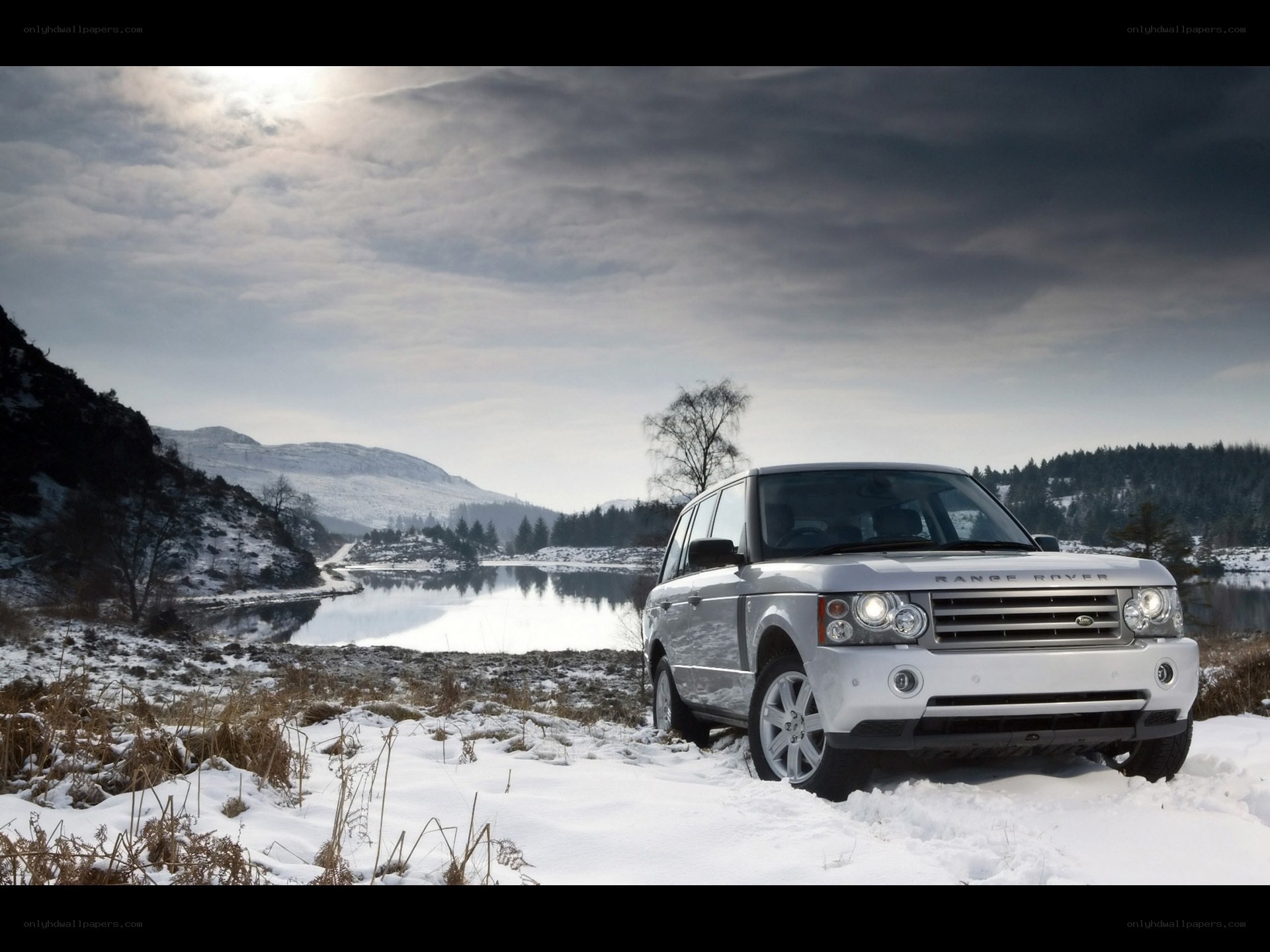 Silver Range Rover in snowy landscape