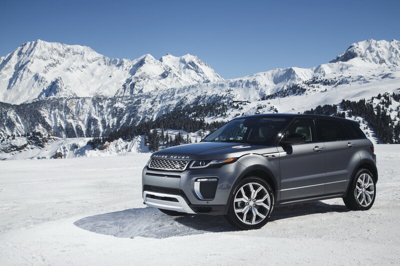 Silver Range Rover in snowy mountains