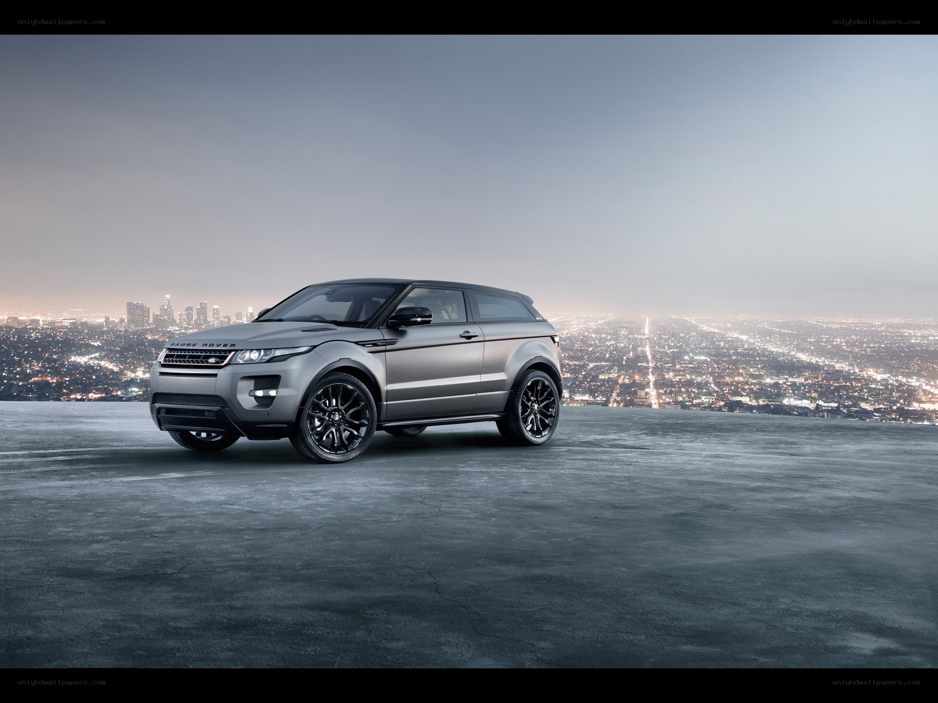 Silver Range Rover on a city overlook