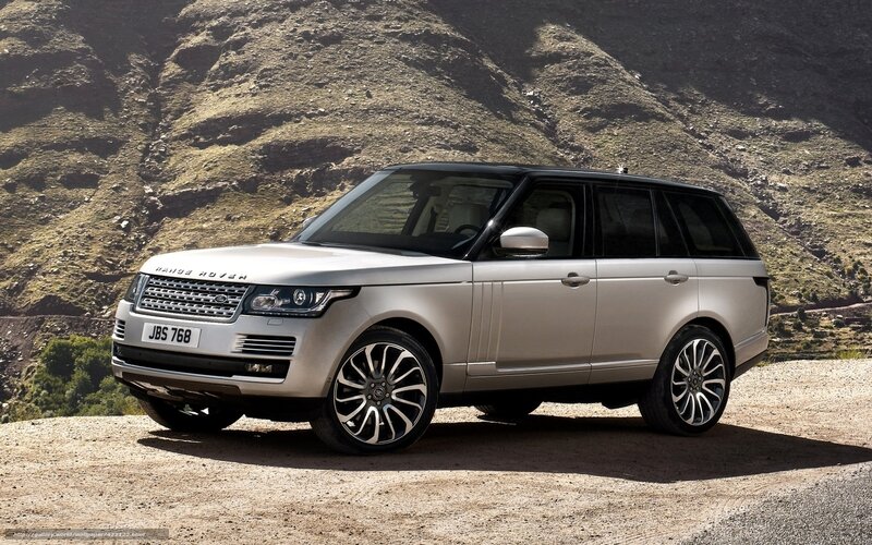 Silver Range Rover on a hill