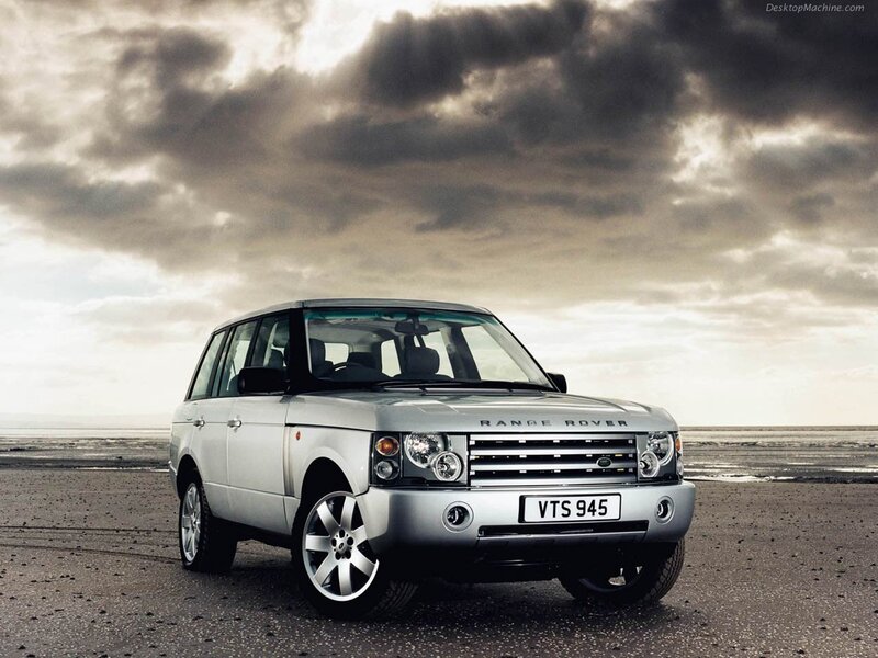 Silver Range Rover on beach