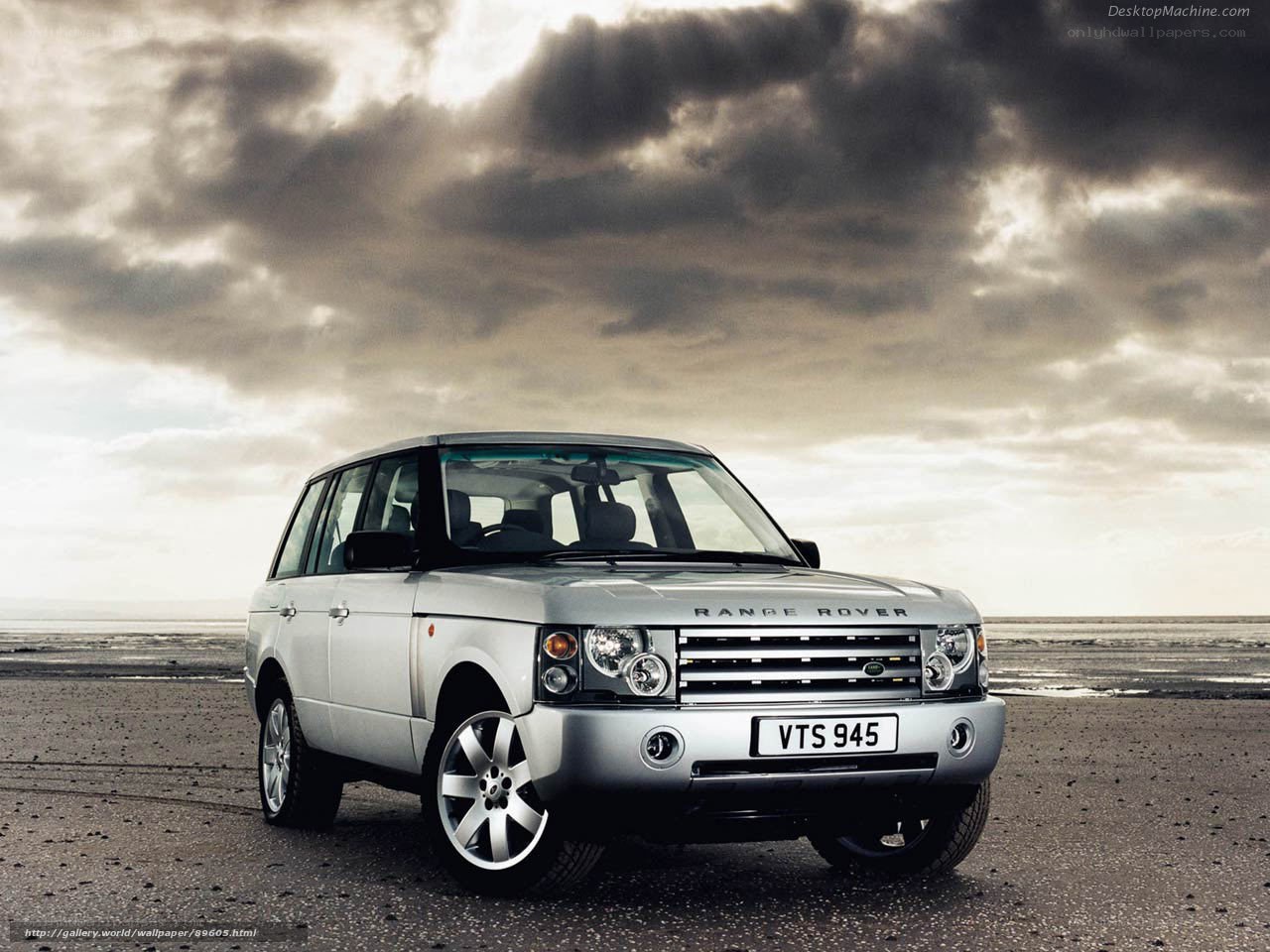 Silver Range Rover on beach