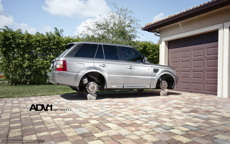 Silver Range Rover on blocks