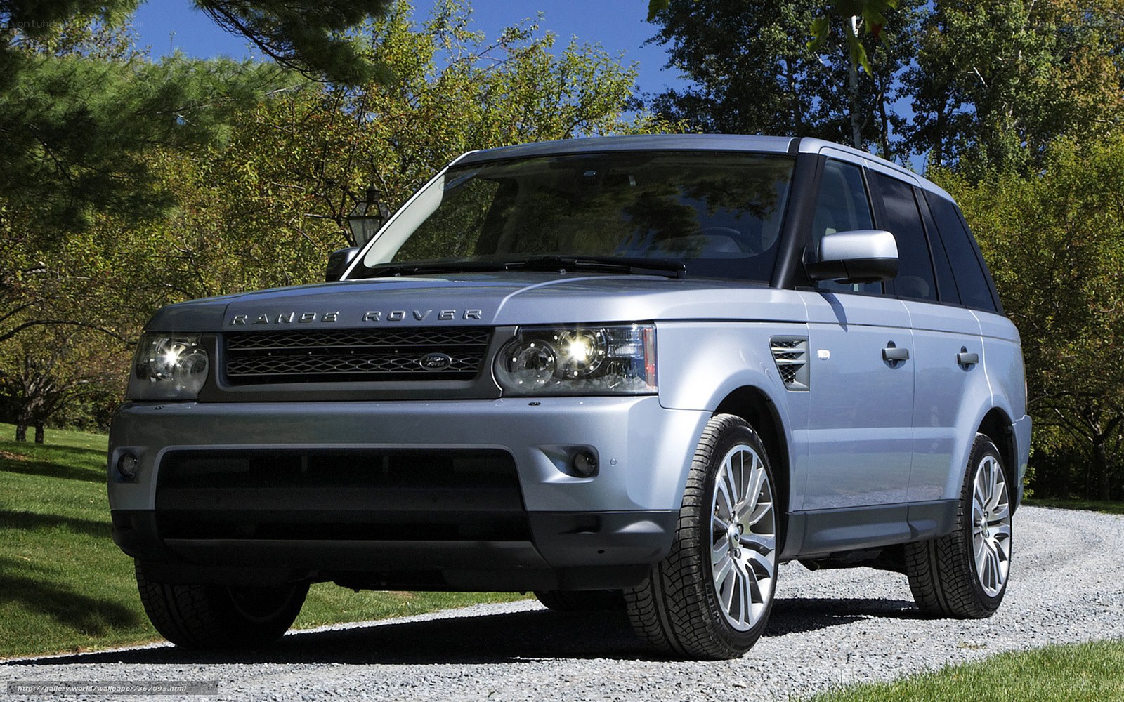 Silver Range Rover on gravel path