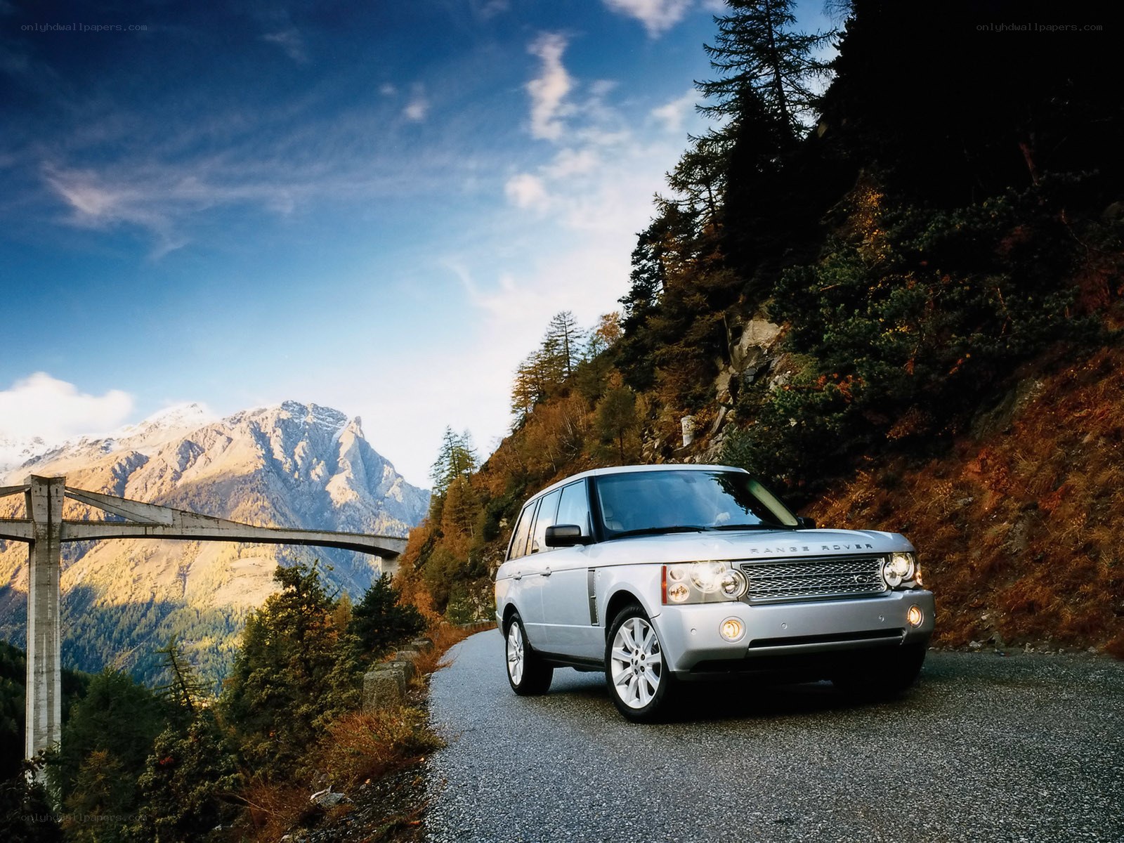 Silver Range Rover on mountain road
