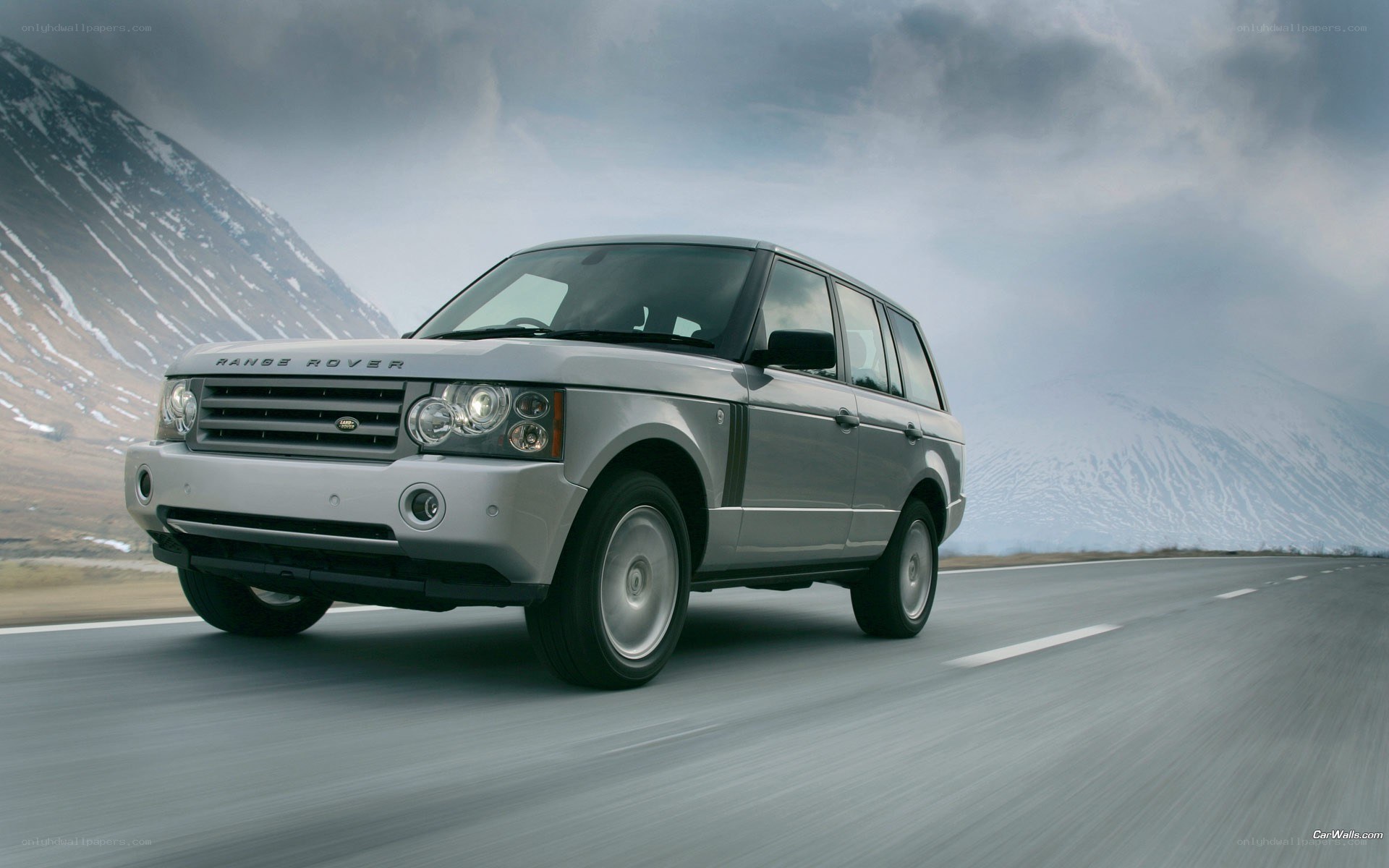 silver range rover on mountain road