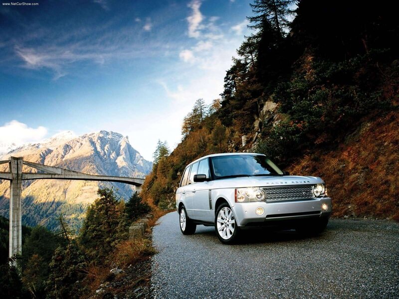 Silver Range Rover on mountain road